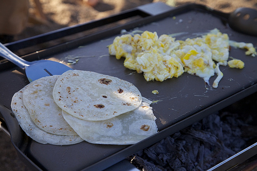Cooking eggs and tortillas in the bacon grease. Can life get any better?