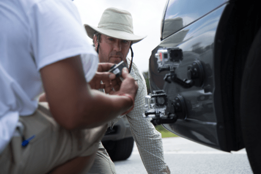 Photo Caption: Shane Hurlbut, ASC Cinematographer on Need for Speed, oversees the mounting of GoPro cameras on set
